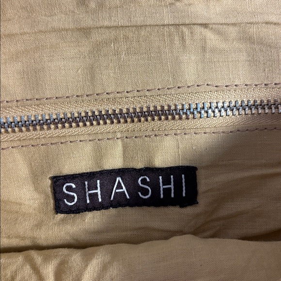 Shashi Leela Crossbody bag with coins and full fringe woven crossbody strap - Picture 4 of 5